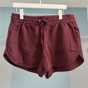 H&M Women's Athletic Shorts. Burgundy. Sz large. Elastic waistband w/tie detail.